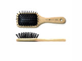 Wood hair brush with rounded polyamide pins set in pneumatic cushion