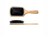Wood hair brush with rounded polyamide pins set in pneumatic cushion
