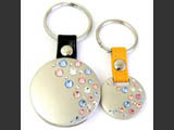 Two silver color round shaped key rings with Swarovski crystals